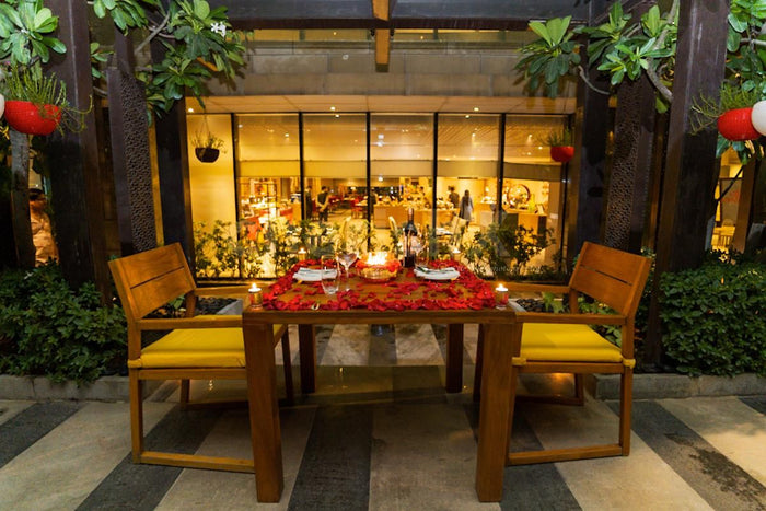 Open air deck dining by The Leela
