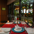 Indoor candlelight dinner at Dilli 32, The Leela Ambience Convention Hotel, Delhi