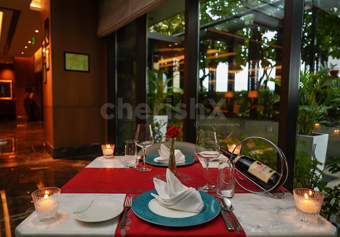 Indoor candlelight dinner at Dilli 32, The Leela Ambience Convention Hotel, Delhi