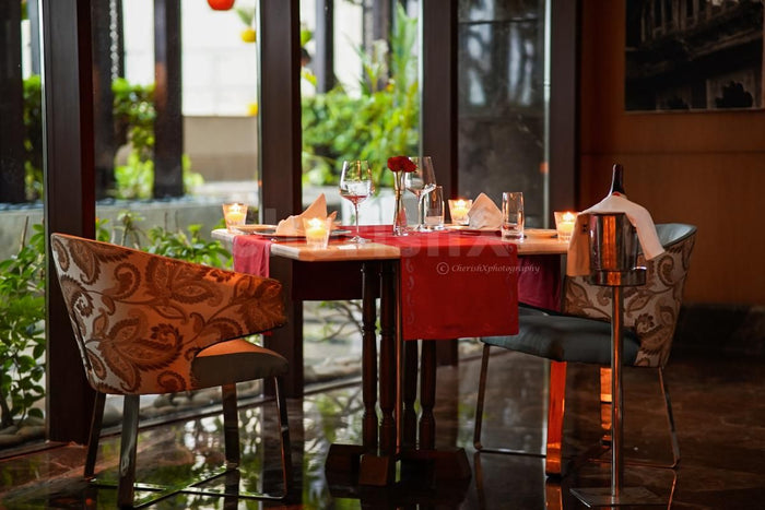 Indoor candlelight dinner at Dilli 32, The Leela Ambience Convention Hotel, Delhi