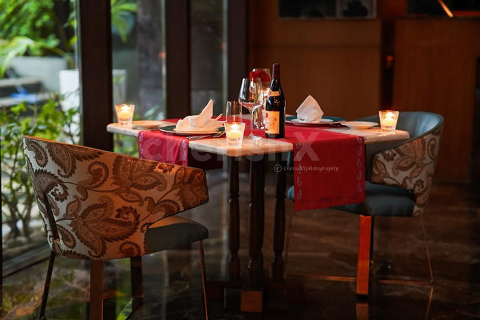 Indoor candlelight dinner at Dilli 32, The Leela Ambience Convention Hotel, Delhi