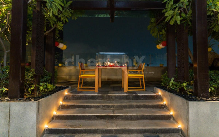 Open air deck dining by The Leela