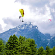 Soaring 10-Minute Tandem Paragliding Adventure Over Kashmir with Free Video