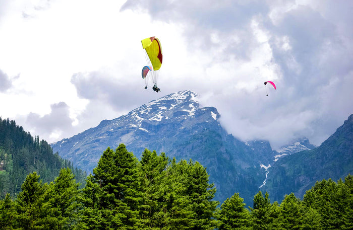 Soaring 10-Minute Tandem Paragliding Adventure Over Kashmir with Free Video