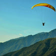 Soaring 10-Minute Tandem Paragliding Adventure Over Kashmir with Free Video