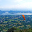 Soaring 10-Minute Tandem Paragliding Adventure Over Kashmir with Free Video