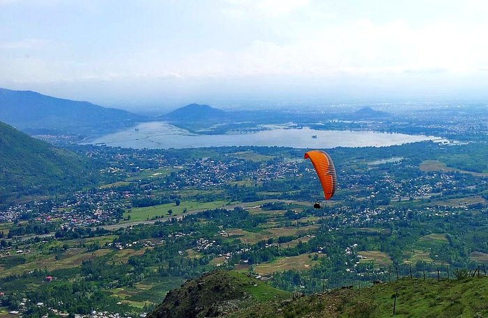 Soaring 10-Minute Tandem Paragliding Adventure Over Kashmir with Free Video