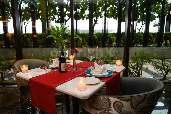 Indoor candlelight dinner at Dilli 32, The Leela Ambience Convention Hotel, Delhi
